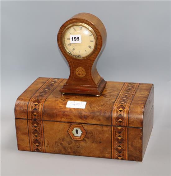 A Victorian parquetry writing slope and a mantel timepiece